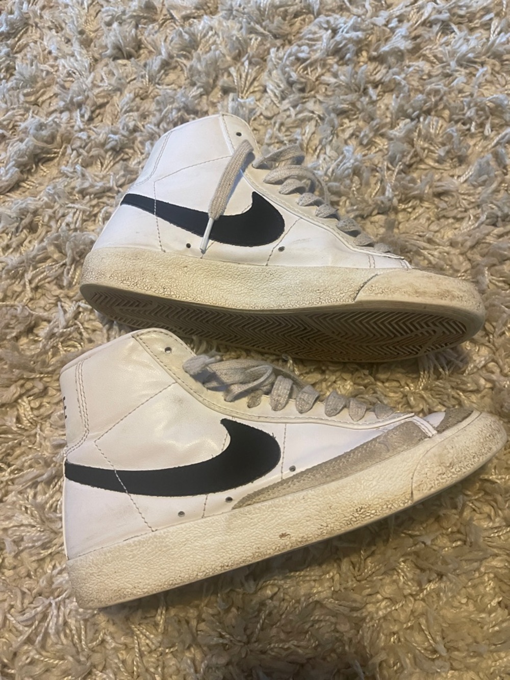 Nike White High-Top Sneakers with Black Swoosh